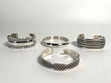 FOUR STERLING SILVER BANGLES | BRACELETS