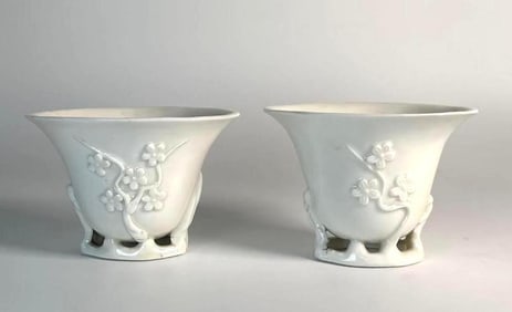 PAIR OF BLANC DE CHINE DEHUA PORCELAIN LIBATION CUPS