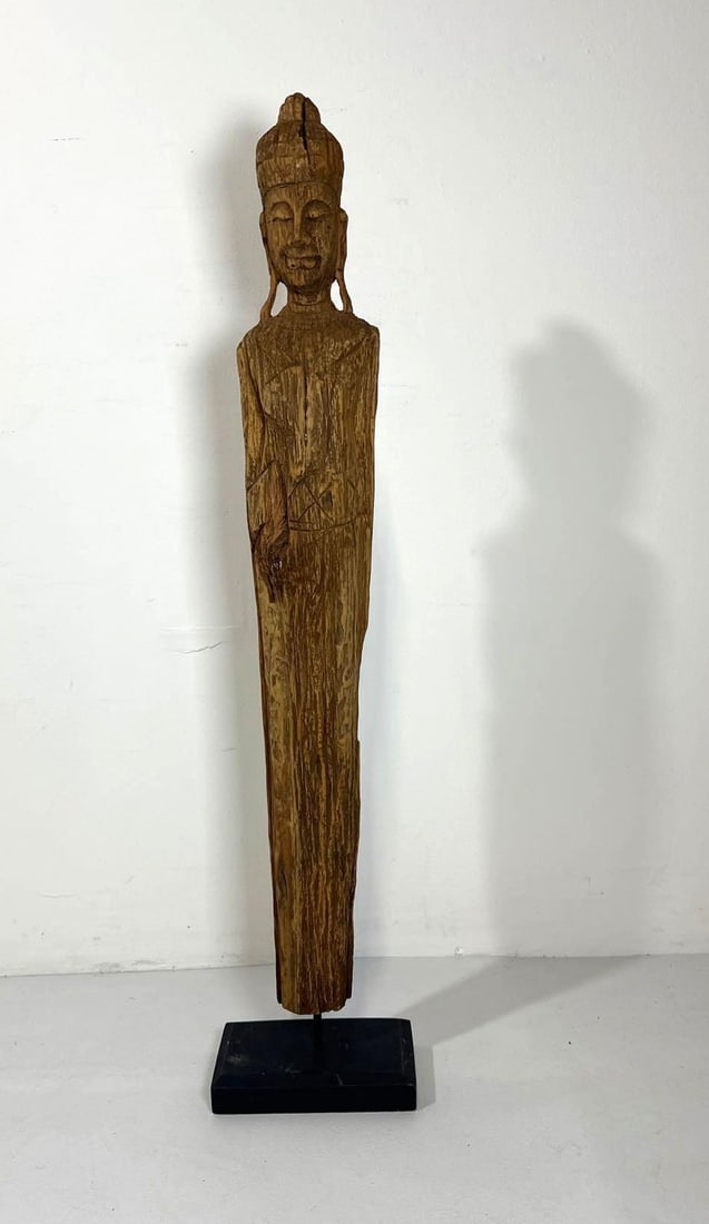 BALINESE CARVED WOOD DEITY STATUE: This impressive 39-inch wood statue (most likely Balinese) is a hand-carved representation of a spiritual figure, possibly Buddha or a guardian deity, showcasing the rich artistic traditions of Indone