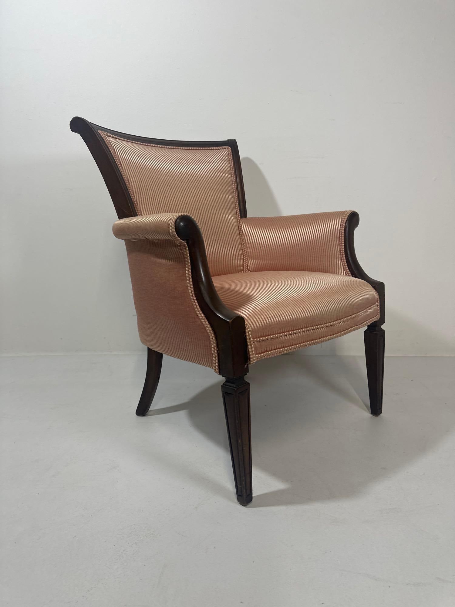 VINTAGE ARMCHAIR WITH STRIPED UPHOLSTERY: This elegant armchair features a classic design with a touch of vintage charm, making it a sophisticated addition to any living space. The chair is upholstered in a subtle striped jacquard fabric with