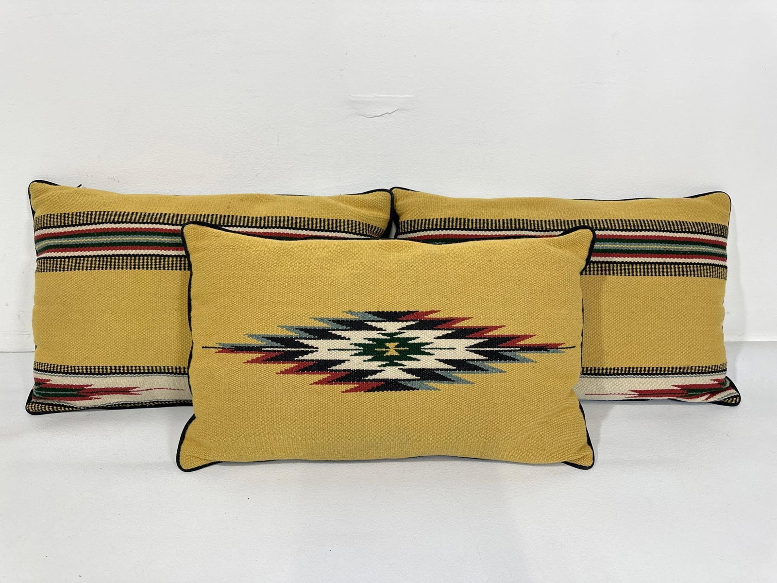 TRIO OF VINTAGE KILIM STYLE CUSHIONS: Evoking the rich heritage of woven textiles, this trio of Kilim style cushions presents a visual feast of patterns and textures. Sized at a generous 22.5" x 13.5", these cushions offer both co