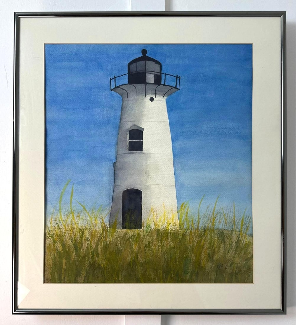 VALUE LOT EDGARTOWN LIGHTHOUSE WATERCOLOR SIGNED NA 1991: A framed watercolor painting of the Edgartown Lighthouse, rendered in a realistic style against a blue sky with foreground grass, signed "NA" and dated 1991. Dimensions: 20x18 Artist or Maker: