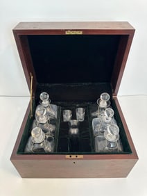 ANTIQUE TANTALUS WITH FITTED DECANTERS & GLASSES