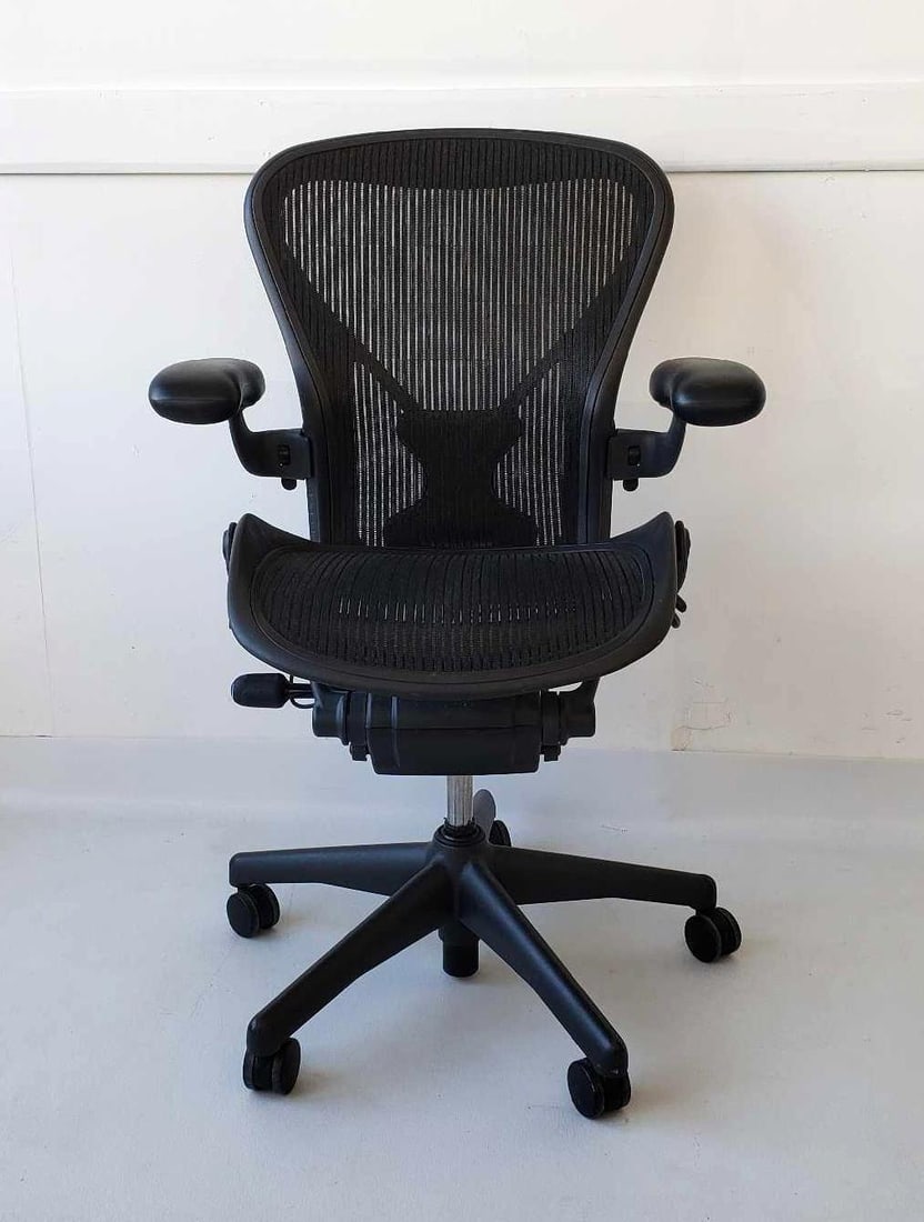 HERMAN MILLER AERON CHAIR (1): Black Aeron Chair Size B Dimensions 41.5"H X 26"W X 24"D Artist or Maker: Herman Miller Notes: Although care is taken to photograph and describe the item, absence of a condition report doe