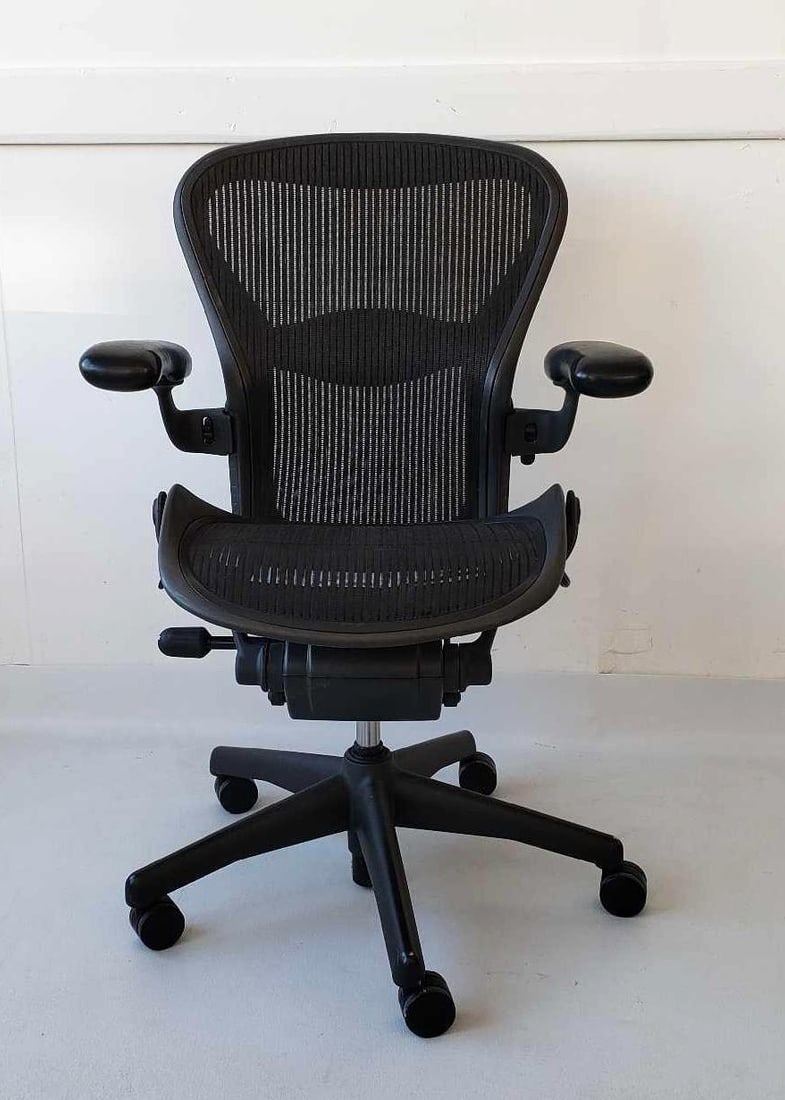 HERMAN MILLER AERON CHAIR (4): Black Aeron Chair Size B Dimensions 41.5"H X 26"W X 24"D Artist or Maker: Herman Miller Notes: Although care is taken to photograph and describe the item, absence of a condition report doe