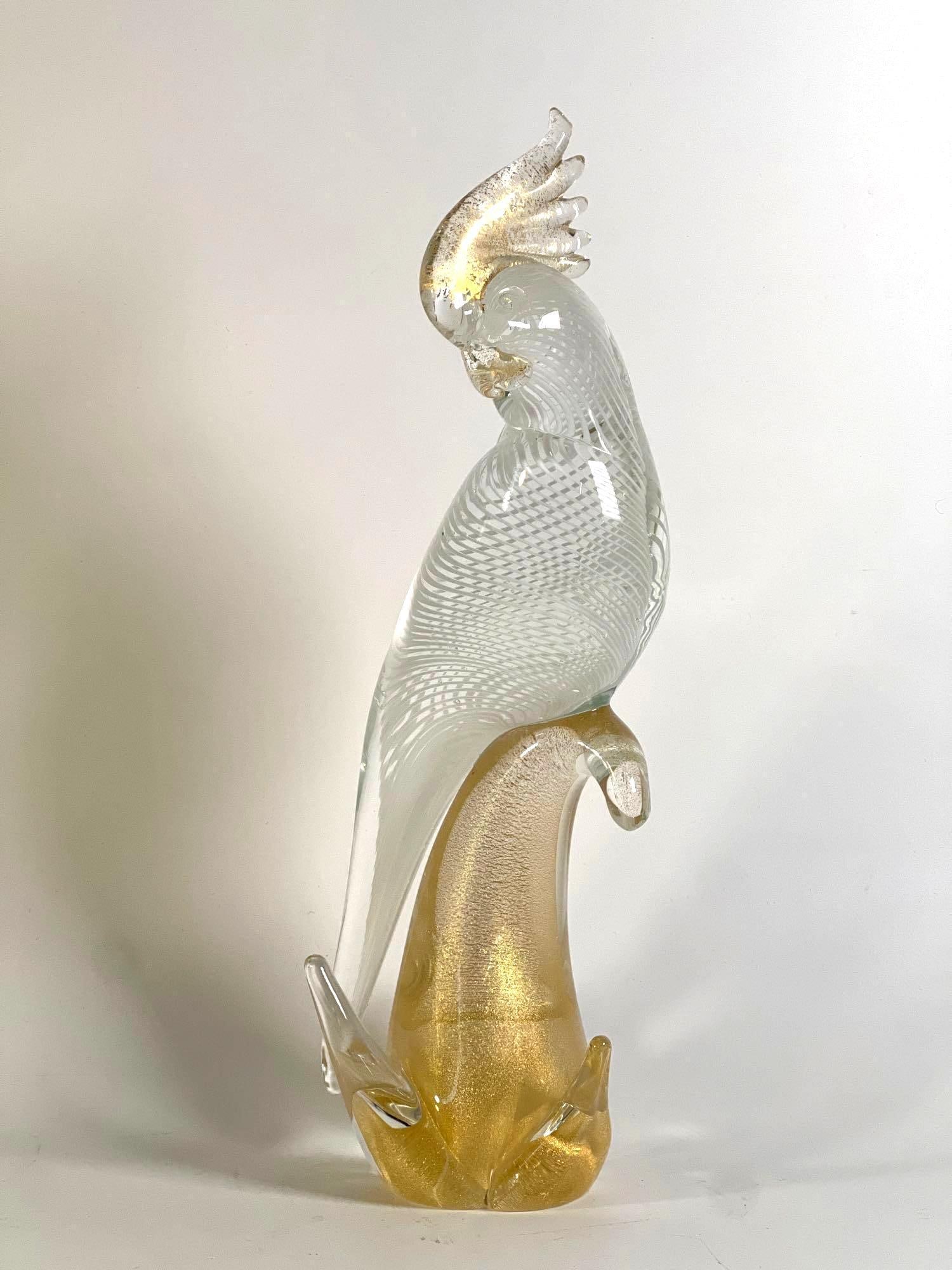 VINTAGE MURANO GOLD FLECKED GLASS COCKATOO: Italian gold and clear glass bird sculpture Dimensions :12” H Artist or Maker: Murano Notes: Although care is taken to photograph and describe the item, absence of a condition report does not im