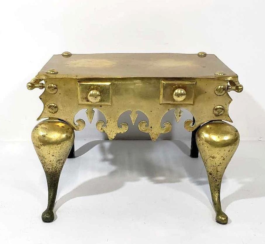 ANTIQUE ENGLISH GEORGIAN BRASS TRIVET/ KETTLE STAND: This exquisite antique English Georgian brass trivet/kettle stand is a testament to the craftsmanship and elegance of 18th-century metalwork. The trivet features a rectangular base with intricately ca