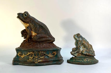 A PAIR OF VINTAGE CAST IRON FROG DOOR STOPS