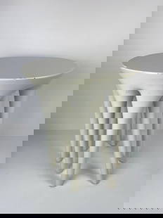 DESSIN FOURNIR NIMBUS TABORET SIDE TABLE: A Dessin Fournir Nimbus taboret, model T4006-W, small, round side table with seven slender, curving legs. Finished in a highlighted white lacquer with a polished top and satin finished sides. (New Ret