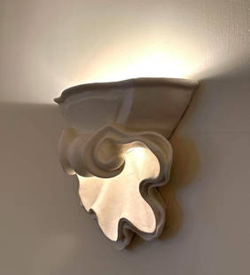 PAIR OF ART DECO PLASTER SHELL FORM WALL SCONCES AFTER JEAN-CHARLES MOREUX (2 of 2): A pair of Art Deco wall sconces in the form of stylized shells, crafted from white plaster and attributed to designer Jean-Charles Moreux. From the Moschino NYC showroom Dimensions: 12” x 14&rdq