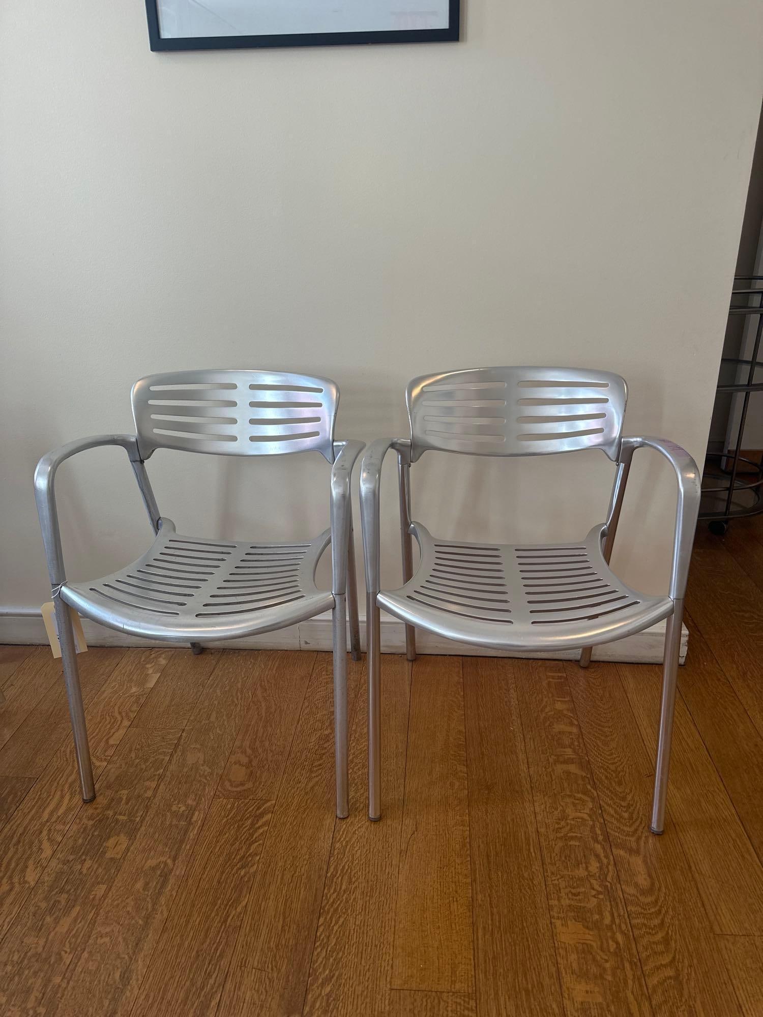 JORGE PENSI TOLEDO CHAIR - ALUMINUM (10 OF 17 ): A pair of Jorge Pensi Toledo chairs, constructed from aluminum with a slatted seat and back. From the Moschino NYC showroom. Dimensions: W26 D29 H31. ]Artist or Maker: Jorge Pensi This item is par