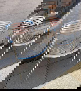 JORGE PENSI TOLEDO CHAIR - ALUMINUM (LOT 12 OF 17 ): A pair of Jorge Pensi Toledo chairs, constructed from aluminum with a slatted seat and back. This pair was used outdoors, so finish is dulled and aluminum is discolored, see photos. From the Moschino