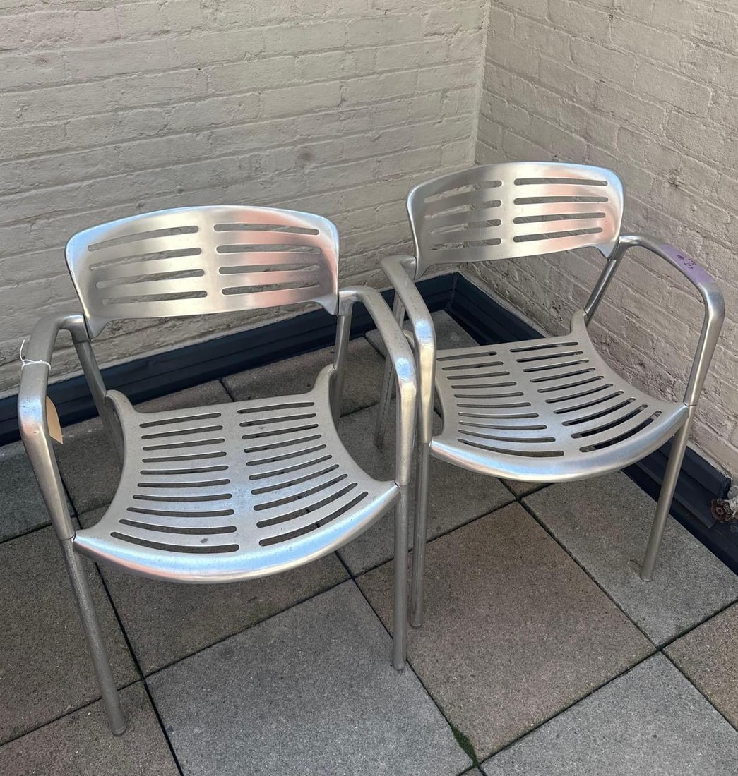 JORGE PENSI TOLEDO CHAIR - ALUMINUM (13 OF 17 SETS): A pair of Jorge Pensi Toledo chairs, constructed from aluminum with a slatted seat and back. This pair was used outdoors, so finish is dulled and aluminum is discolored, see photos. From the Moschino