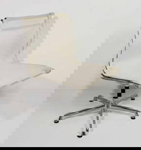 HERMAN MILLER EAMES ALUMINUM GROUP CHAIR EA330 - (17 OF 22): A Herman Miller Eames Aluminum Group side chair. It features a light-colored mesh or fabric seat and back suspended on a polished aluminum frame with a four-star base. From the Moschino NYC showroom