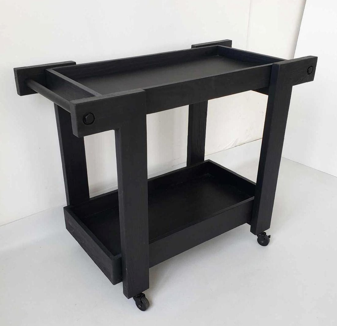 WILLIAMS SONOMA BENCHWRIGHT MODERN BLACK WOOD AND METAL BAR CART: A Williams Sonoma Benchwright modern bar cart, featuring a black wood and metal construction with a sleek, minimalist design, and smooth-rolling casters. Dimensions: 30"h x 37"w x 18"d Artist or Mak