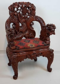 JAPANESE CARVED HARDWOOD DRAGON ARMCHAIR WITH MONKEY AND GRAPE MOTIF