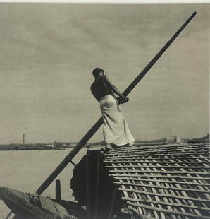 EUSTON SEALY, THE HELMSMAN, SHEET FED GRAVURE, 1940 GREAT BRITAIN: A black and white photo print depicting a shirtless figure piloting a boat. (with certificate of authenticity) Dimensions oa: 16&#34; x 12&#34; image: 7&#34; x 7&#34;  Artist or Maker: Euston Sealy  P