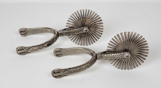 PAIR OF ORNATE SILVER TONED METAL GAUCHO RIDING SPURS