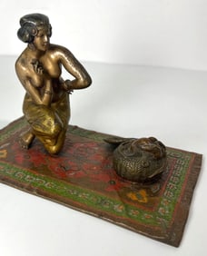ANTIQUE BRASS SCULPTURE OF A SNAKE CHARMER IN THE STYLE OF FRANZ BERGMAN