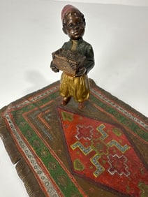 VINTAGE BOY ON A CARPET AUSTRIAN BRONZE PAINTED SCULPTURE AFTER FRANZ BERGMAN