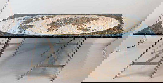 UNUSUAL STONE TOP WORLD MAP DESK/TABLE ON CAST ALUMINUM SAW HORSE FORM LEGS
