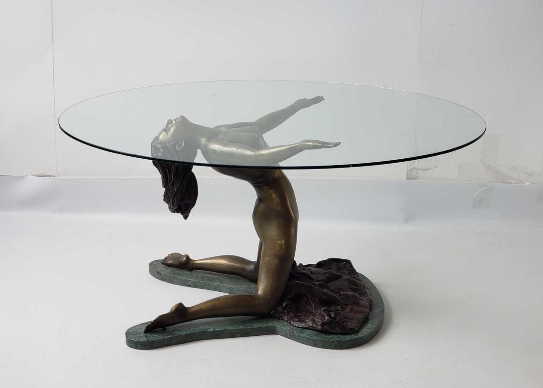 ART DECO FEMALE NUDE FIGURAL BRONZE AND MARBLE TABLE BASE IN THE MANNER OF GEORGE VAN DE VOORDE: This is a bronze sculpture depicting a nude female figure kneeling on a green marble base, with her torso arched backward, arms outstretched, and long hair flowing downwards. Serves as a table base.