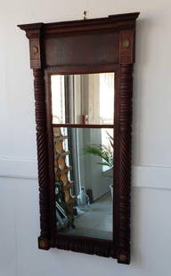 ANTIQUE AMERICAN FEDERAL, SHERATON-STYLE MAHOGANY AND CHERRY SPLIT PANEL MIRROR: **An antique American Federal, Sheraton-style split panel mirror features a dark-toned mahogany and cherry wood frame with carved spiral columns along the sides and decorative roundels at the corners