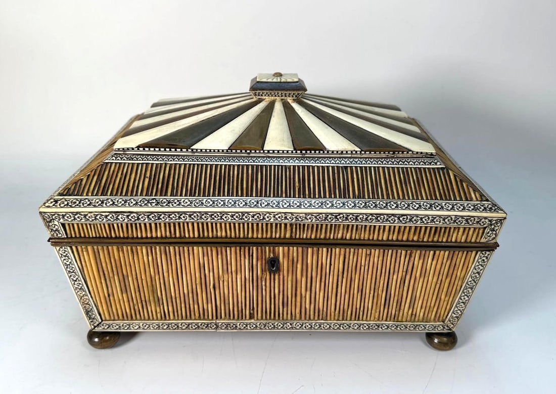 ANTIQUE LARGE ANGLO-INDIAN INLAID BONE, QUILL & WOOD JEWELRY BOX: An antique Anglo-Indian inlaid bone, quill, and wood jewelry box. The box boasts a hexagonal, stepped form, adorned with intricate geometric patterns crafted from contrasting light bone and dark wood