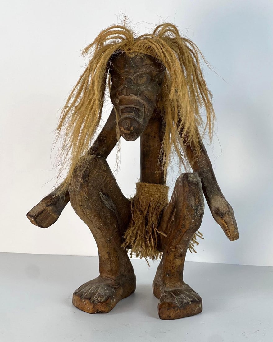 CROUCHING WOODEN STATUE W/ RAFFIA HAIR (1 of 8)