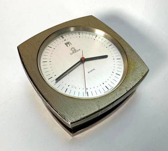 RARE VINTAGE OMEGA '8 DAYS' MECHANICAL DESK CLOCK STAINLESS STEEL REF. # 7015: A very rare vintage Omega &#39;8 Days&#39; mechanical desk clock / paperweight clock, reference #7015. The clock features a square, brushed stainless steel metal case with a round white face.  Dimensi