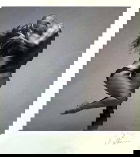 ROY VOLKMANN SIGNED PHOTOGRAPH "DANCE AND LOVE": A signed print by Roy Volkmann, titled &#34;Dance and Love&#34;. The black and white image captures two figures, a male and a female, in a close embrace.  Dimensions: oa 14&#34; x 11&#34;  Artist or M