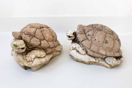 PAIR OF VINTAGE CEMENT TORTOISE FOUNTAINS: A pair of resting tortoise garden sculptures made from light-colored cement. Both have green eye detail.  Dimensions: 6&rdquo;T x 11&rdquo; x 9&rdquo;  Artist or Maker: Signed, indecipherable. Dated 1