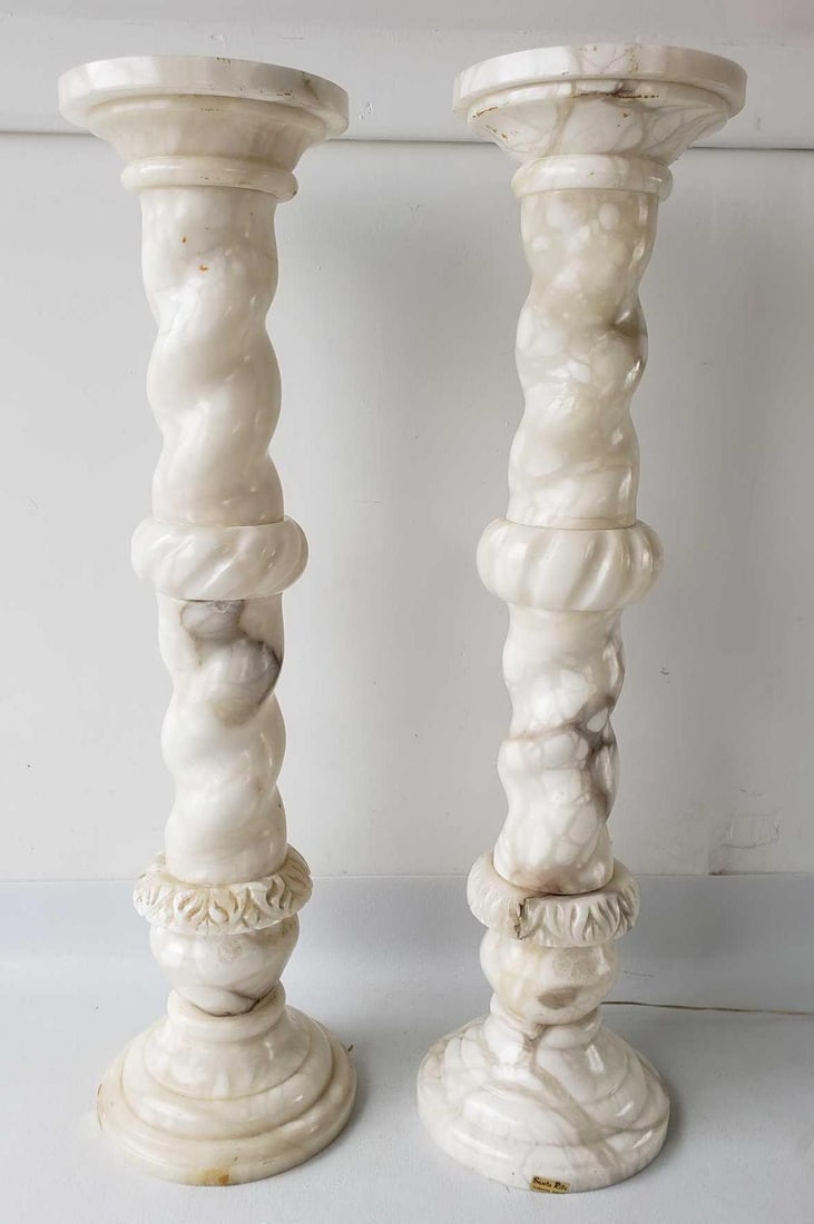 NEAR PAIR OF VINTAGE ALABASTER SANTA RITA COLUMNS, ONE ILLUMINATED: *This near pair of vintage alabaster Santa Rita columns, one of which is illuminated, stands as a testament to the timeless beauty and craftsmanship of carved stone decor. Each column, measuring 38.75