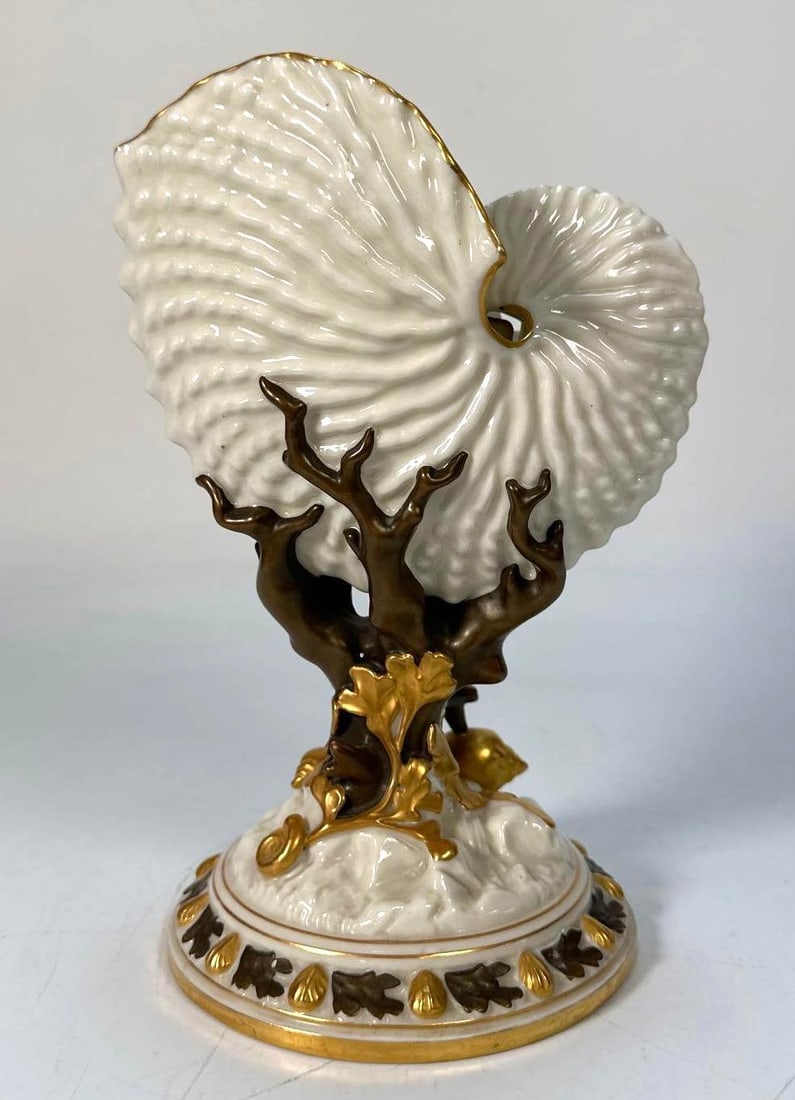 ROYAL WORCESTER PORCELAIN NAUTILUS SHELL VASE ON GILT BRONZE STAND: *An antique Royal Worcester porcelain nautilus shell vase, C. 1900 Dimensions: 8.5"T X 5.75"W Artist or Maker: Royal Worcester Notes: Although care is taken to photograph and describe the item
