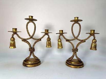 PAIR OF VINTAGE HOLLYWOOD REGENCY ITALIAN TOLEWARE CANDELABRAS: * A pair of vintage Three-Light Candelabras with a gilt tassle & rope motif. Dimensions: 12.5"T X 10.5"W Artist or Maker: Unknown Provenance: A New York Collector Notes: Although care is taken