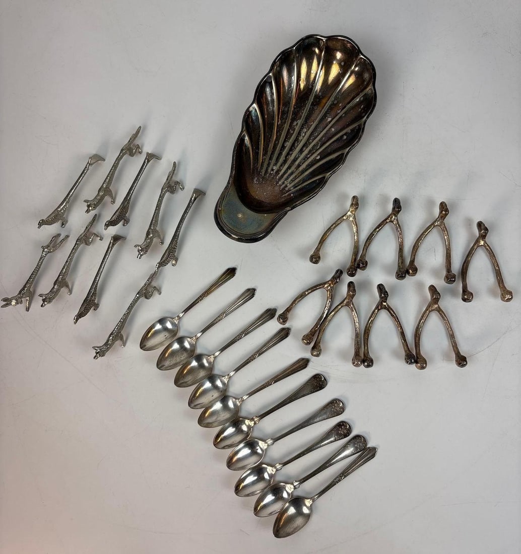 LIVING ESTATE OF JOSEPH RODANO: COLLECTION OF SILVER-PLATED TABLEWARE & NOVELTY ITEMS: A collection of silver-plated tableware and novelty items. The group features a fluted shell-shaped dish, an array of ornate spoons and a collection of pheasant and wish-bone themed knife holders. Di