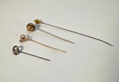 FOUR ANTIQUE VINTAGE PINS -  GOLD? / GOLD TONED STICK / HAT PINS WITH DECORATIVE FINIALS