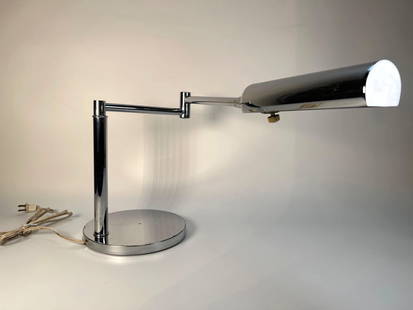 VINTAGE MID-CENTURY MODERN KOCH & LOWY OMI SWING ARM CHROME DESK LAMP: A vintage Mid-Century Modern Koch &amp; Lowy swing arm chrome desk lamp. The lamp features a highly polished chrome finish throughout, presenting a minimalist design with a circular base.  Dimensions: