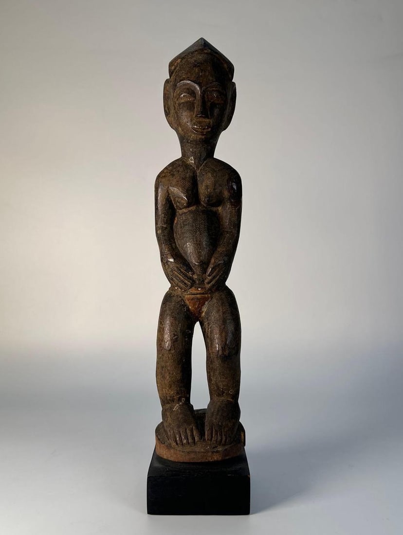 AFRICAN UPPER VOLTA CARVED WOODEN TRIBAL FIGURE: An African Upper Volta carved wooden tribal figure. Dimensions: 13.5"h Artist or Maker: Unknown Provenance: From a NYC Collector. Notes: Although care is taken to photograph and describe th