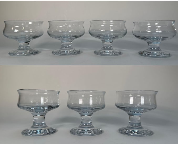 SEVEN PIECE COLLECTION OF HOLMEGARD SHERBET DISHES: A collection of Holmegaard sherbet dishes, a 7-piece set in two styles, featuring 4 short and 3 tall glasses. Dimensions: 4"T x 4.25"DIA, 4.25"T x 4"DIA Artist or Maker: Holmegard Provenance: Fr