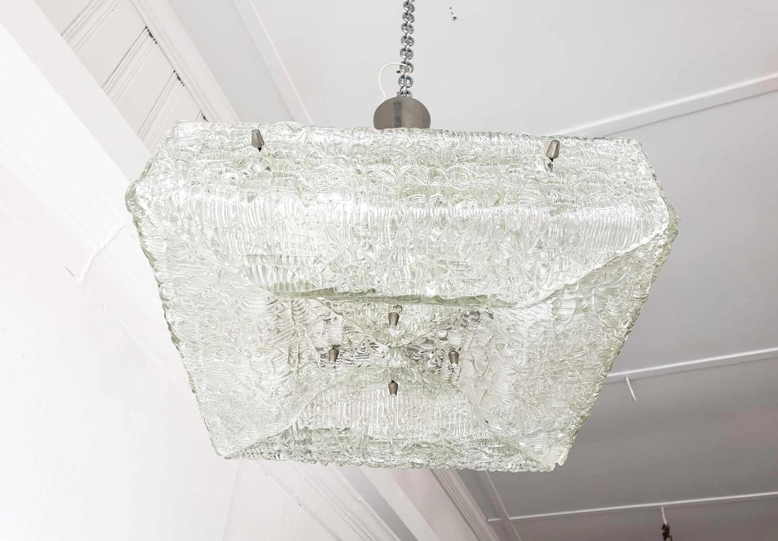 MID CENTURY J.T. KALMER AUSTRIA WATERY STRUCTURED PRESSED GLASS AND CHROME CHANDELIER: Vintage J.T. Kalmar Mid-Century Modern "Ice Glass" Chandelier Dimensions: 15"h hanging. Fixture only 4.25"h x 15"w x 15"d Maker: J.T. Kalmar Provenance: A New York collector Notes:Please note