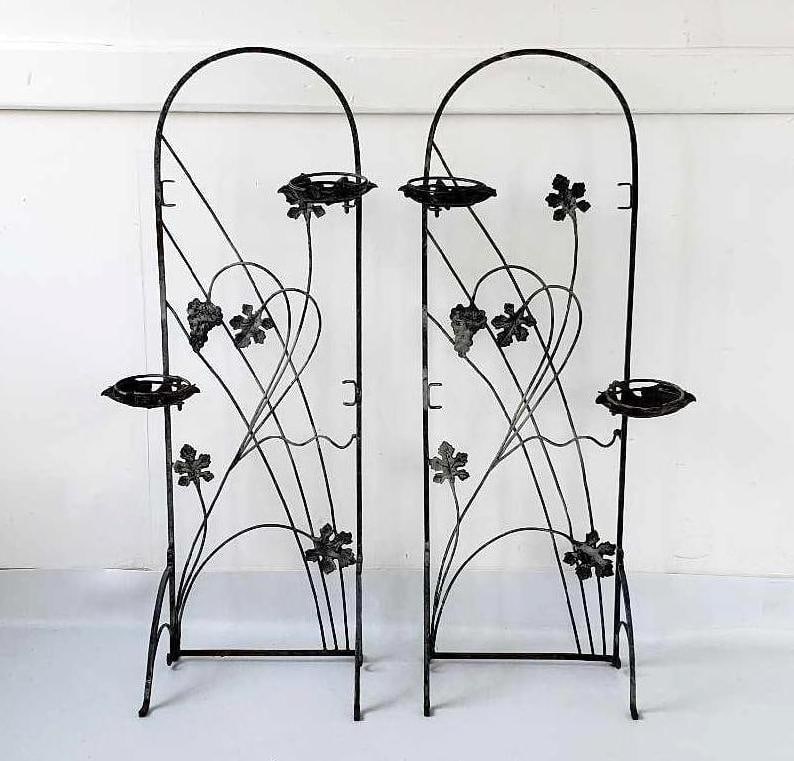 PAIR OF VINTAGE ARCHED IRON PLANT STANDS IN THE MANNER OF SALTERINI: *A pair of vintage arched iron plant stands, crafted in the manner of Salterini. Dimensions: 43.75"h x 14"w x 11"d Artist or Maker: Unknown Provenance: From a NYC Collector. Notes: Although