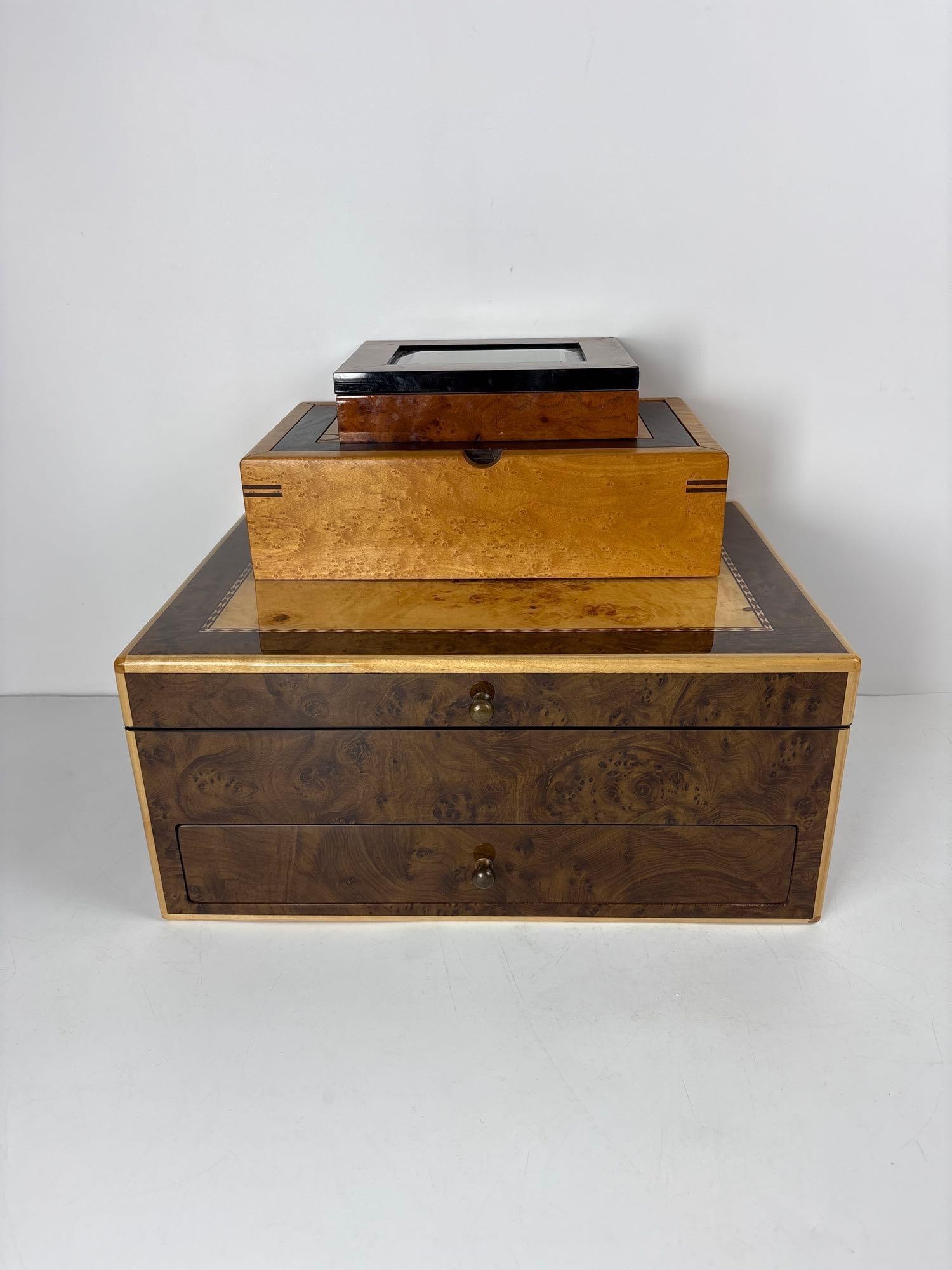 TRIO OF WOODEN BOXES: A trio of wooden boxes. Dimensions: 7" Tall x 16" x 12" Artist or Maker: Unknown, one with original label marked Reed and Barton. Provenance: From a NYC Collector. Notes: Although care is tak