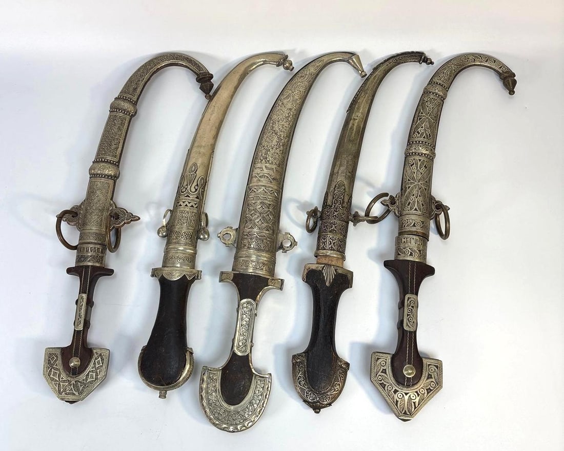 A SET OF FIVE ORNATE MIDDLE EASTERN JAMBIYA DAGGERS (1 of 5)