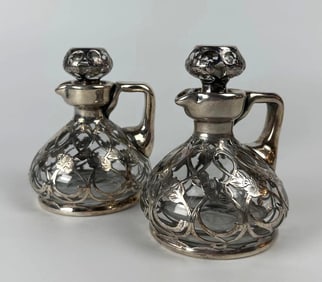 PAIR OF SILVER OVERLAY AND GLASS CRUET DECANTERS