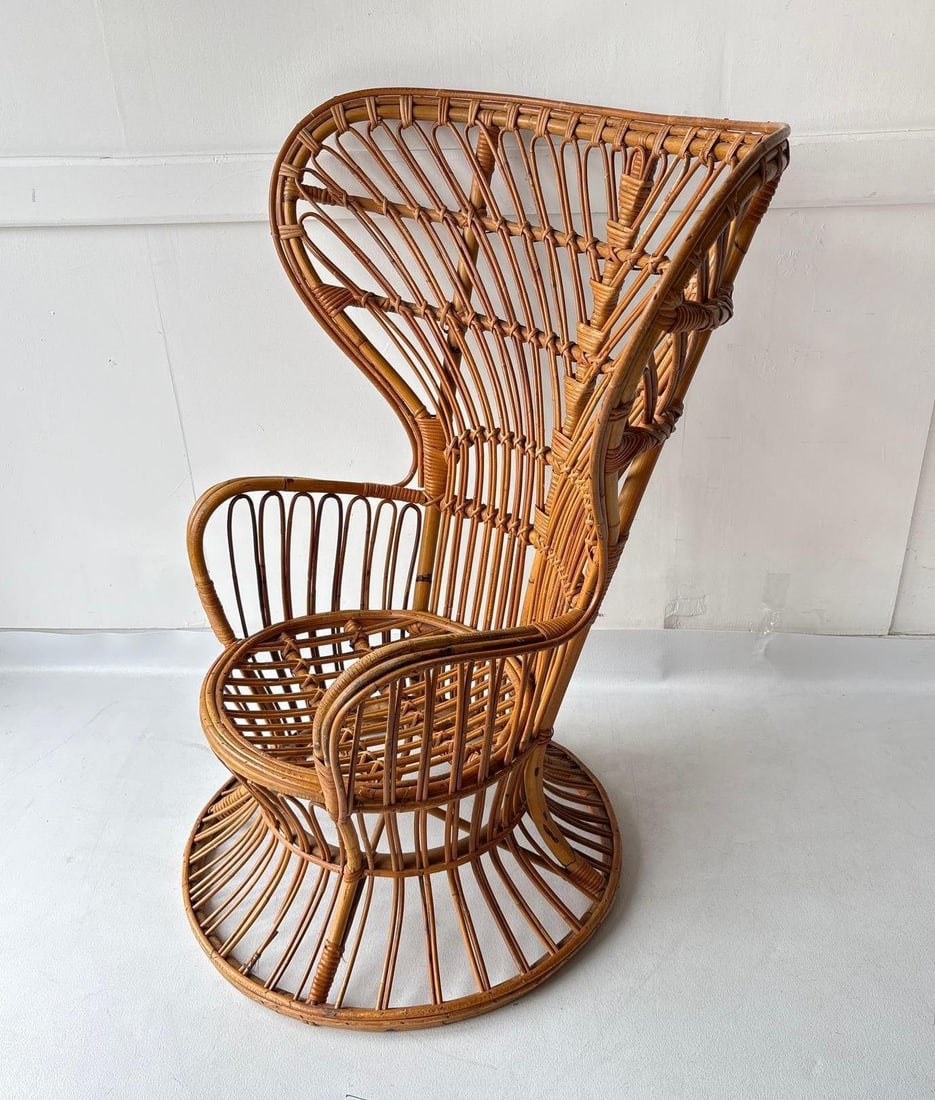 PEACOCK CHAIR: Vintage Mid-Century Bohemian Rattan Peacock Chair Dimensions: 47" x 41" Artist or Maker: Unknown Provenance: A New York Collector Notes: Although care is taken to photograph and describe the item