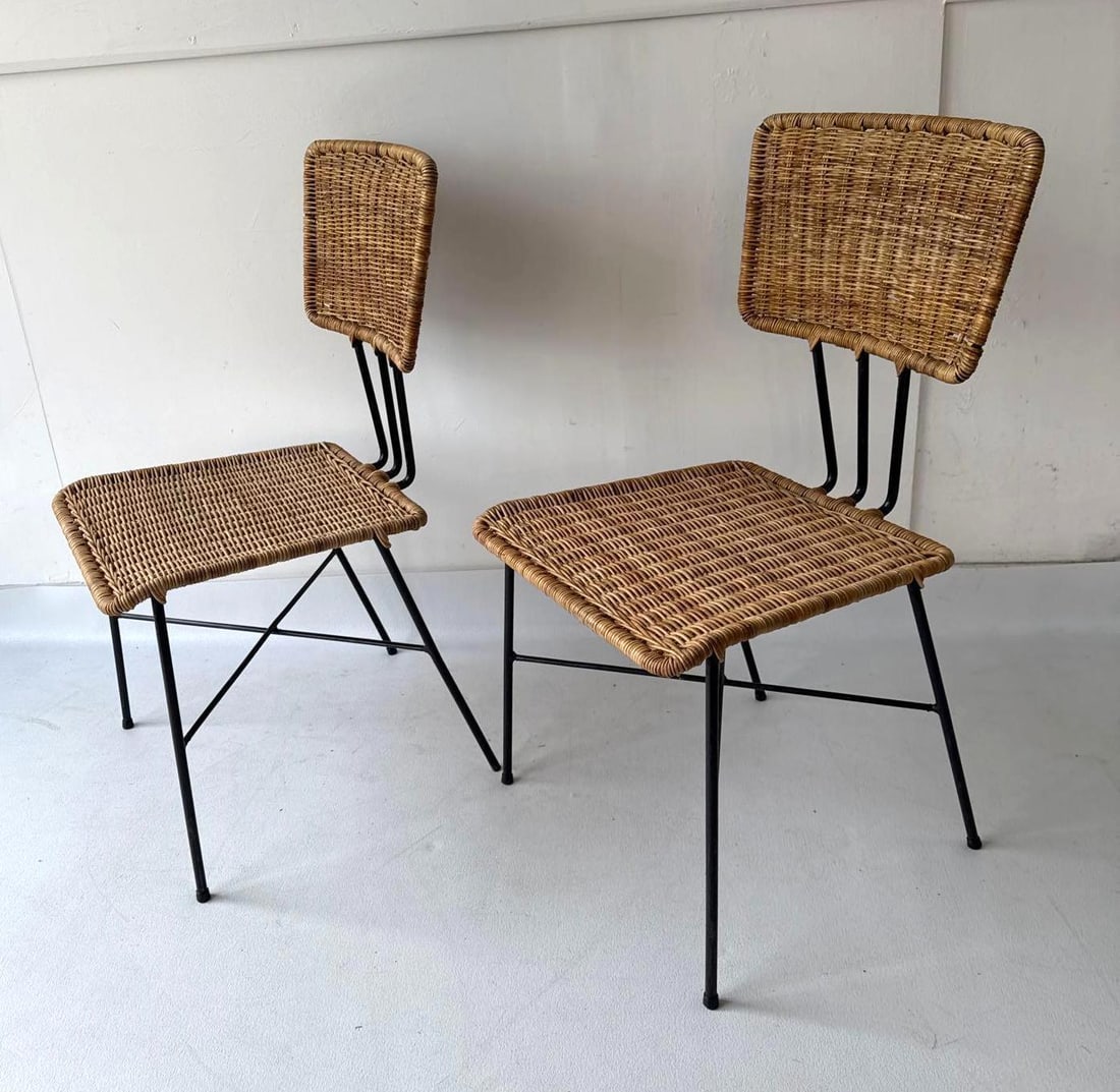 UNUSUAL PAIR OF METAL AND WICKER CHAIRS: A pair of metal chairs with woven natural fiber seats Dimensions: 17" X 18" X 35". SEAT HEIGHT 17.5" Maker: Unknown Provenance: A New York Collector Notes: Although
