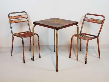 VINTAGE DISTRESSED METAL CAFE TABLE ATTRIBUTED TO JEAN PROUVE AND TWO STACKING METAL CHAIRS