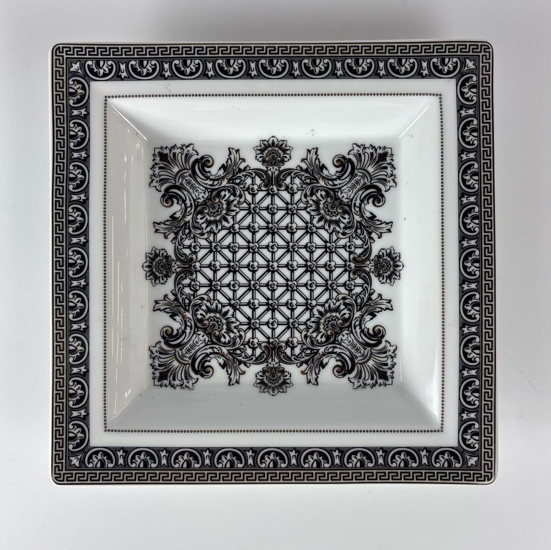 VERSACE MARQUETERIE BY ROSENTHAL DISH: Dimensions 1" x 8.5" x 8.5" Maker: Rosenthal for Versace Provenance: Property of an Upper East Side, NYC estate. Notes: Although care is taken to photograph and describe the item, absence of a condi