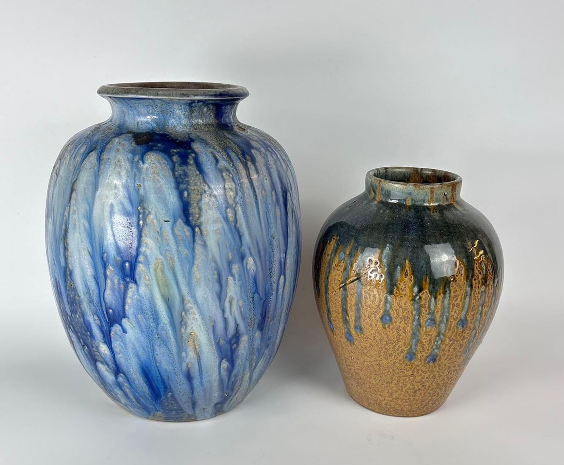 VASE PAIR INCLUDES LARGE ROGER GUERIN STONEWARE SIGNED: A Pair of vases, one signed. Dimensions Largest Dimension: 15" T x 9" dia Artist/Maker: Larger blue vase: Roger Guerin, smaller is unknown Provenance: A New York Collector Notes: Although c